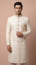 Cream Embroidered Sherwani with Stone Accents and Chain Brooch