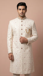 Cream Embroidered Sherwani with Stone Accents and Chain Brooch
