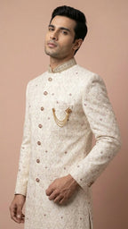 Cream Embroidered Sherwani with Stone Accents and Chain Brooch