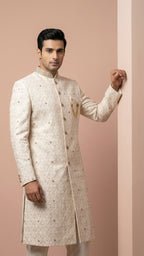 Cream Embroidered Sherwani with Stone Accents and Chain Brooch